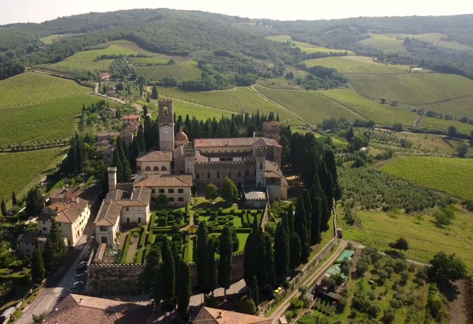 Aerial view of the Badia a Passignano abbey among Chianti Classico vineyards